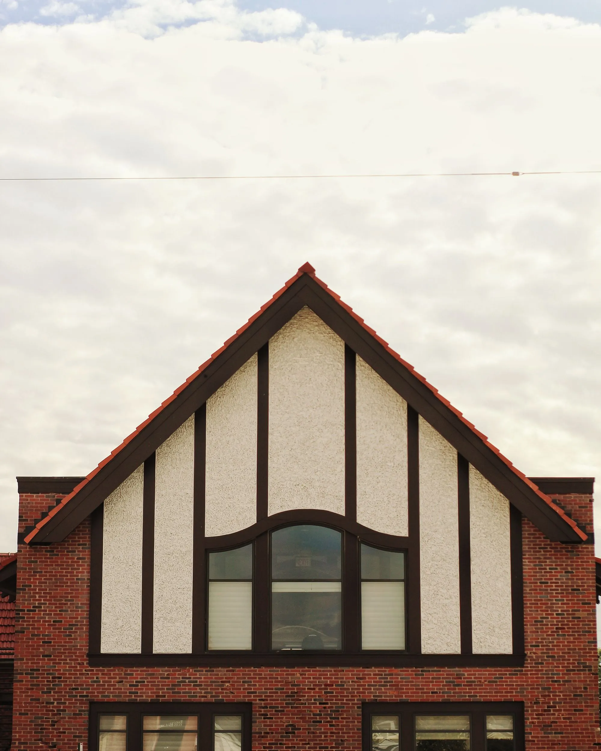 A white painted gable end against the sky